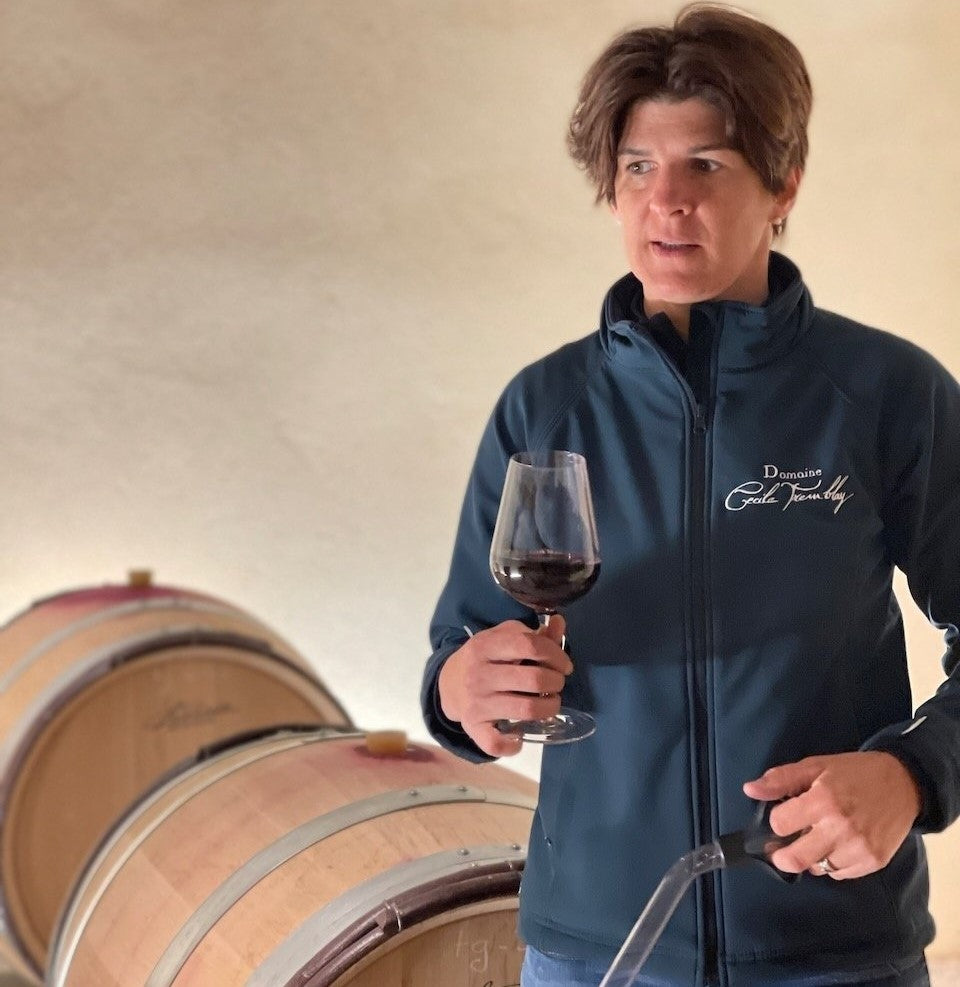 Cécile Tremblay tasting the wine from barrel