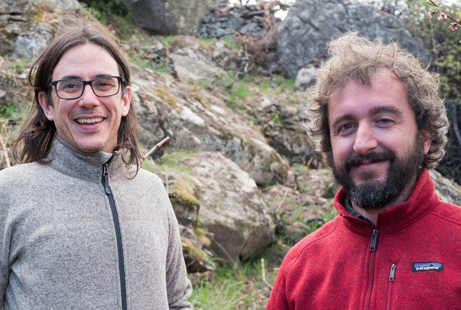 Fernando Garcia and Dani Landi standing in La Brena vineyard. 