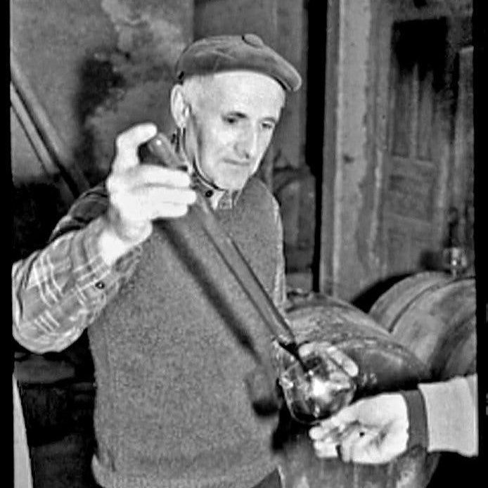 Marius Gentaz in the cellar providing a barrel sample