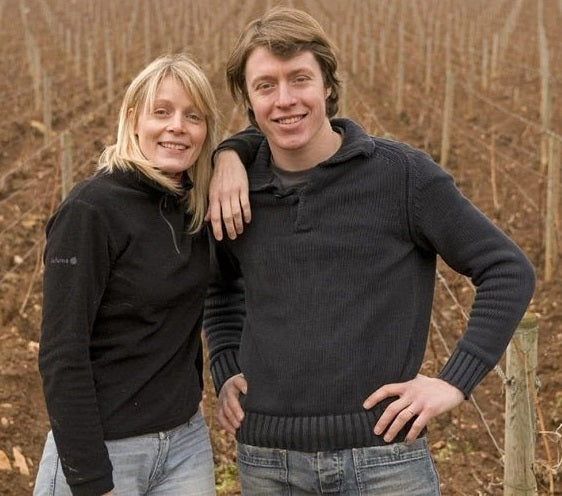 Thierry and Chrystelle standing in their vineyard in Chassagne-Montrachet.